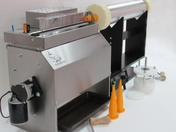 Pneumatic dough gun with nozzles for boilie making